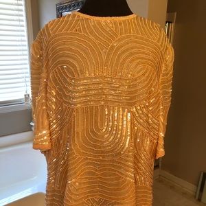 Peach colored sequined top